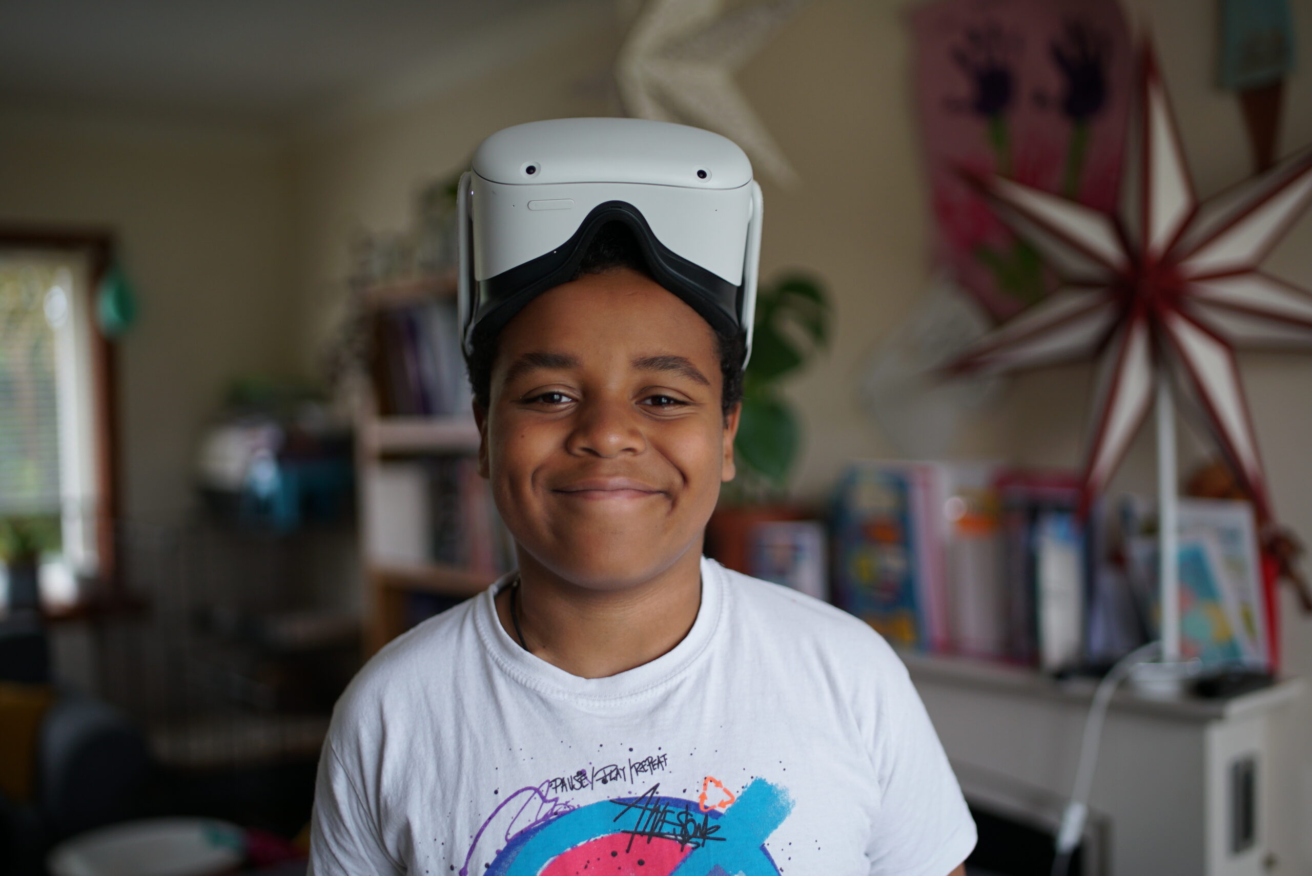 A Make-A-Wish child enjoying gaming with a headset