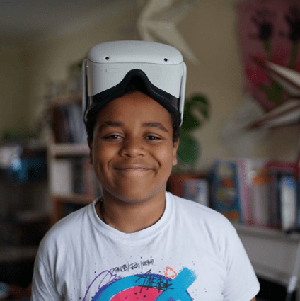 Smiling child wearing a VR headset